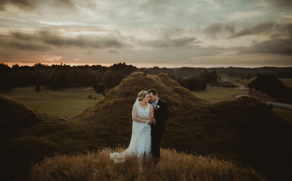 A couple getting married on a hill