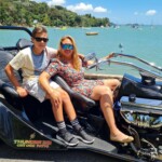 Bay of Islands Thunderbike mom and son sitting infront of ocean