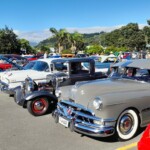 classic cars parked in Whangamata for Beach Hop